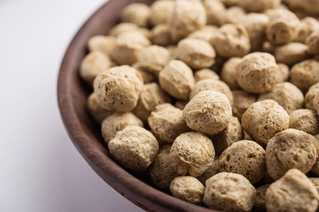 Soyabean seeds in a wooden scoop